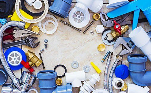 Assorted plumbing fittings and tools